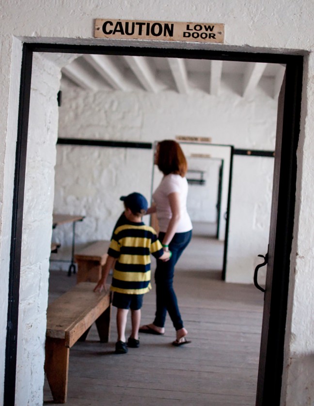 6 year-old Will and mom, Jacklyn, explore the family quarters and school house in Fort Henry.