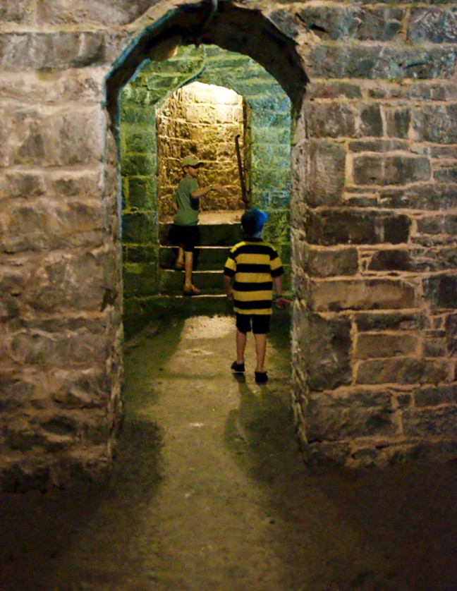 Will and Tom pretending to be members of the Fort Henry Guard as they explore the secret passages of the Fort.