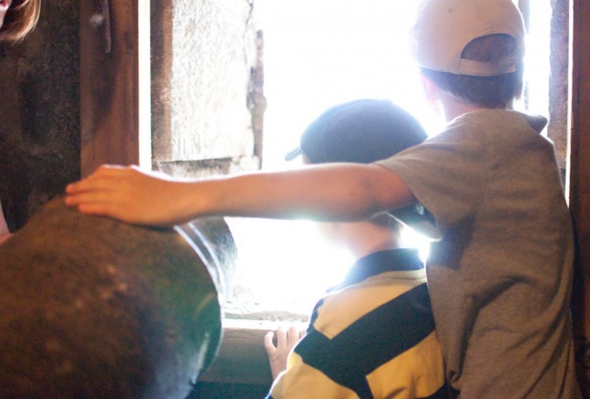 Will and Tom peering out the windows of the reverse battery at Fort Henry.