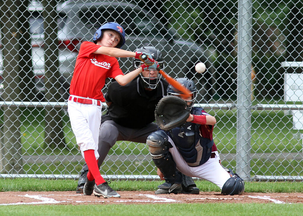 A kid batting at the Canadian Little League Championships