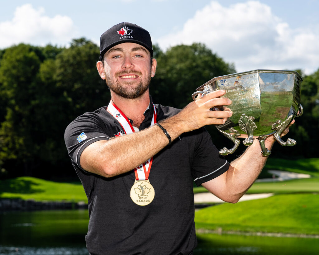 Ashton McCulloch holding a trophy