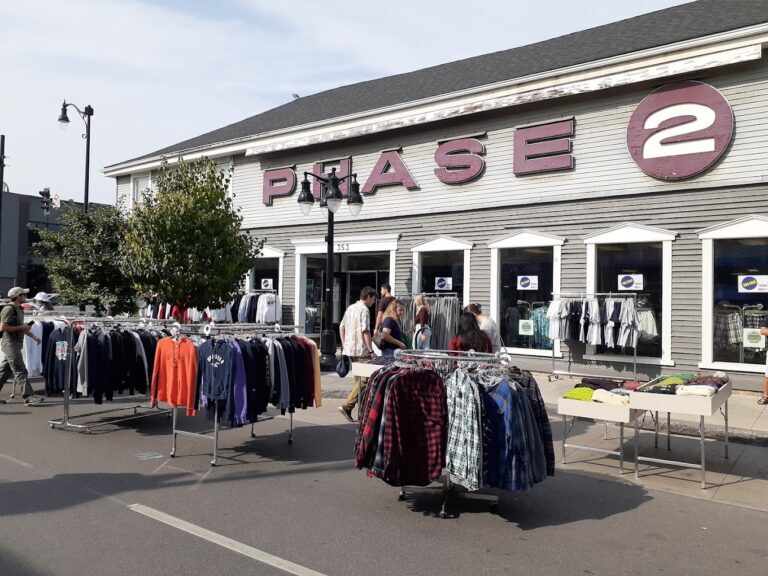 image of Phase 2 street storefront with an outdoor market during a special event